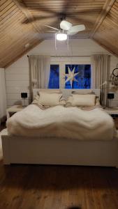 Postel nebo postele na pokoji v ubytování Villa Aihkiranta