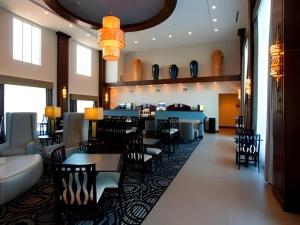 a dining room with tables and chairs and a restaurant at Holiday Inn Express & Suites Fredericksburg By IHG in Fredericksburg
