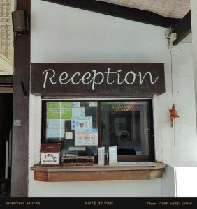 a restaurant sign on the side of a building at Coral Beach Club in Matabungkay +132 photos