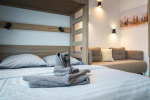 Ένα ή περισσότερα κρεβάτια σε δωμάτιο στο Apartmán Amelka Vysoké Tatry