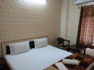 Una habitación en Madhav Guest House