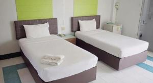 Postel nebo postele na pokoji v ubytování Kumkaew Udon