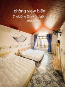 Giường trong phòng chung tại San Hô Hòn Chùa Home