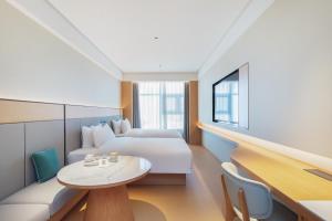 Postel nebo postele na pokoji v ubytování JI Hotel Hangzhou Linping Economic Development Zone Xingqi Road