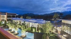 an image of a building with a swimming pool at B2 Mae Hong Son Premier Hotel in Mae Hong Son