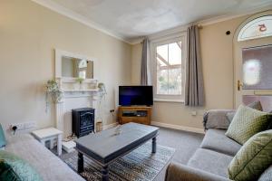 Et tv og/eller underholdning på Marrams View by Winterton Cottages