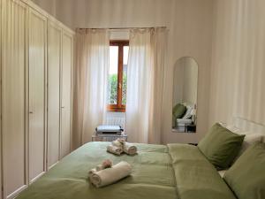 En eller flere senge i et værelse på La corte di Rolando - A Florence hideaway