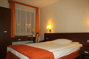 Posteľ alebo postele v izbe v ubytovaní Hotel Arena Expo