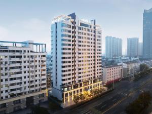 an aerial view of a city with tall buildings at Citadines Luyang Hefei in Hefei