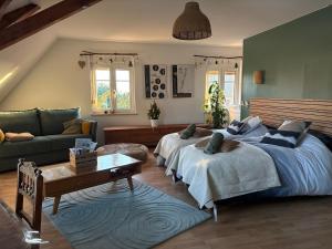 Postel nebo postele na pokoji v ubytování Gîte le Nid