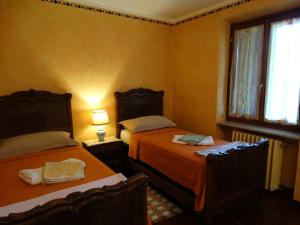 Postel nebo postele na pokoji v ubytování Agriturismo Casa de Colores + 57 fotografií