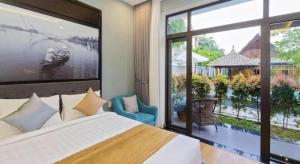 Una cama o camas en una habitación de Friendly Villa Hoian 42 fotos más