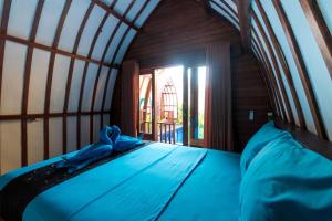 Postel nebo postele na pokoji v ubytování Little Coco Gili Trawangan Hotel