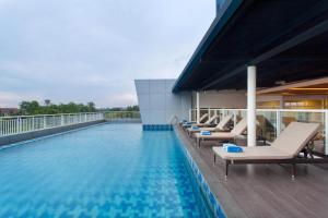 a swimming pool on the roof of a building at Days Hotel & Suites by Wyndham Jakarta Airport in Tangerang