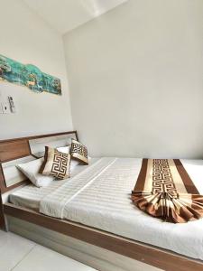 Giường trong phòng chung tại H&Kim Homestay