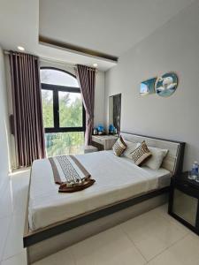 Giường trong phòng chung tại H&Kim Homestay
