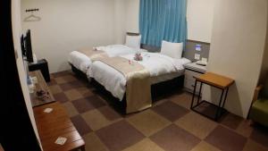 Postel nebo postele na pokoji v ubytování Chang Ti Metropolis Commercial Hotel