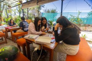 a group of women sitting at a table with a baby at TLO - The Life Outdoor, Bir Billing in Bīr +119 photos