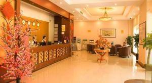 a lobby of a store with people sitting at tables at GreenTree Inn Zhongshan Nanlang Metro Station Branch in Xiazha
