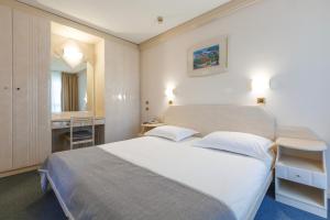 Postel nebo postele na pokoji v ubytování Hotel Gran Vista Plava Laguna