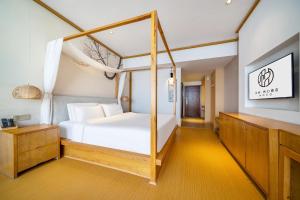 Postel nebo postele na pokoji v ubytování Wuyue Store 2