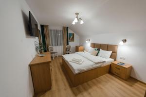 En eller flere senge i et værelse på Casa PEANA