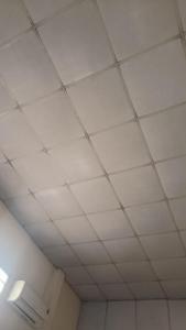 a ceiling in a room with white ceilings at Shen kus to in Quy Nhon