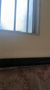 an open window in a room with a floor at Shen kus to in Quy Nhon