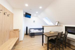 Телевизор и/или развлекательный центр в Appartements Gasthaus Eichholzer