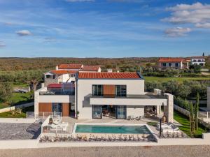 an aerial view of a house with a swimming pool at Sella Verde in Selina