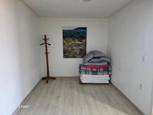 a room with a bed and a cross on the wall at 서라벌옛집 in Gyeongju
