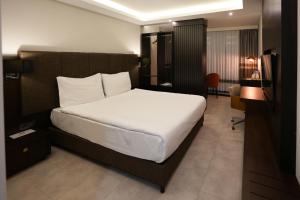 a bedroom with a large bed in a hotel room at Visse Hotel in Mudanya +36 photos