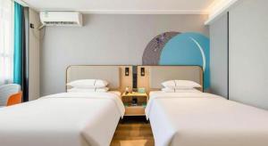 Postel nebo postele na pokoji v ubytování City Comfort Inn Nanning Guangxi University + 179 fotografií