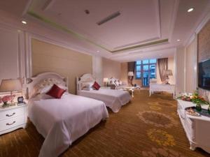 Postel nebo postele na pokoji v ubytování New century Manju Select Hotel Hongqiao Hub National Exhibition Center + 77 fotografií