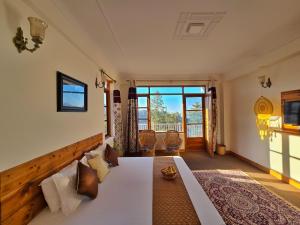 Ένα ή περισσότερα κρεβάτια σε δωμάτιο στο Kufri Farms