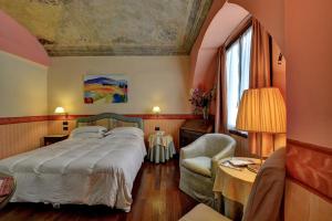 Postel nebo postele na pokoji v ubytování Hotel Due Mondi