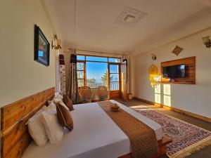 Μια τηλεόραση ή/και κέντρο ψυχαγωγίας στο Kufri Farms +45 φωτογραφίες