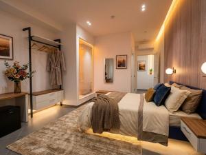 a bedroom with a large bed and a dresser at Le Due Muse b&b in Pagani