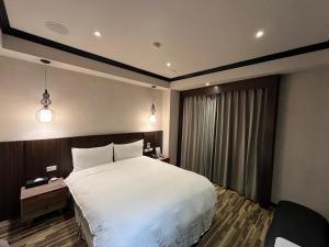 Postel nebo postele na pokoji v ubytování Grace Hotel + 58 fotografií