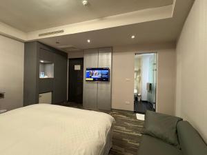 TV a/nebo společenská místnost v ubytování Grace Hotel