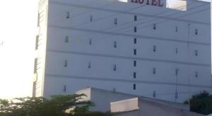 a white building with a sign on the side of it at Trung Luong Hotel 2 in Ấp Long Tương