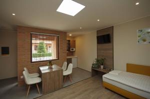 Posteľ alebo postele v izbe v ubytovaní Mosoly Deluxe Apartman