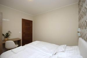 Posteľ alebo postele v izbe v ubytovaní Mosoly Deluxe Apartman