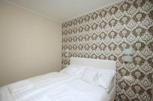 Posteľ alebo postele v izbe v ubytovaní Mosoly Deluxe Apartman