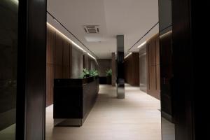 a hallway of a building with a reception desk at Velura Hotel in Ferizaj