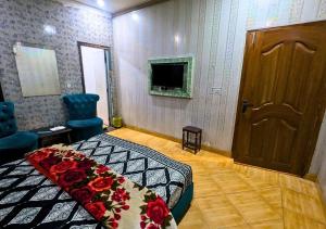 TV a/nebo společenská místnost v ubytování Hayat Palace Hotel Upper Mall