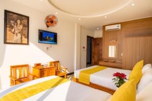 Postel nebo postele na pokoji v ubytování Kim Hoàn Hotel Phan Rang
