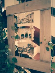 a picture of a building in a wooden picture frame at A Cjase di Lise in Gemona del Friuli