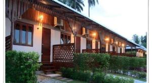 a house with a fence in front of it at Pilton Resort in Ban Huai Yang +50 photos