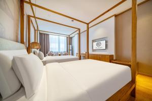 Postel nebo postele na pokoji v ubytování Wuyue Store 2